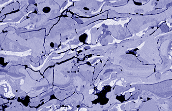 Colorized SEM image of fractures on Plasma-spray coated steel.