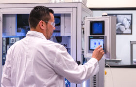 Scientist in front of LE-500 electrospinning/electrospraying system
